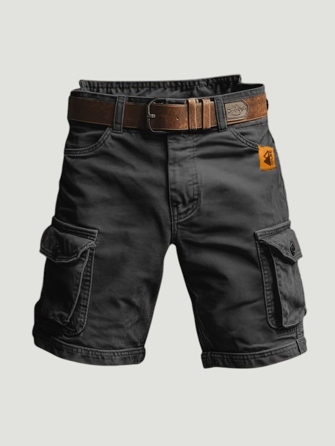 Turowska Moda zwarte spodnie cargo in donkergrijs katoen met bruine riem en functionele zakken.